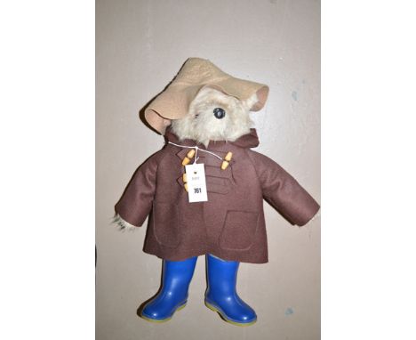 A Paddington bear with brown duffel coat and blue Dunlop wellingtons, design no.957892 with label Gabrielle Designs label.