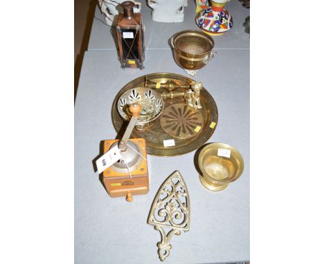 Brassware, to include: horse brasses; trivets; circular tray; a brass musical lantern; and a wooden cased coffee grinder.