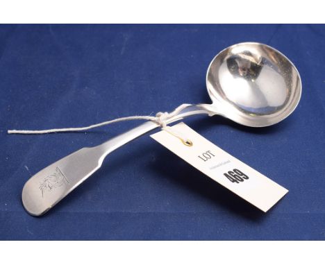 A George IV silver ladle, by J.B., London 1825, in fiddle pattern with engraved crest.