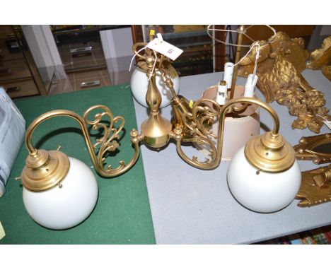 A modern three-branch brass light fitting with white opaque shades; and a table lamp.  (2)