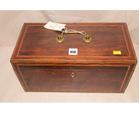 A 19th Century rosewood tea caddy, inlaid and crossbanded in boxwood, ebony and partridge wood, the tope opening to reveal co