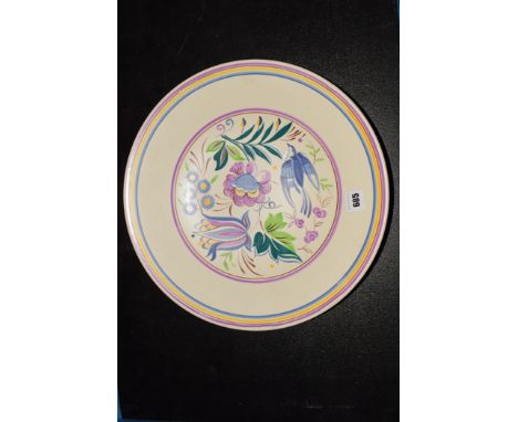 Poole: a pottery plate, shape no. 920, painted with stylized flower and bird design, inscribed 'E/TV', 33cms (13in.) diameter