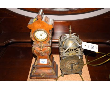 A 19th Century French walnut miniature longcase clock ormolu mounts, by the Hamburg American Clock Co.; and a reproduction la