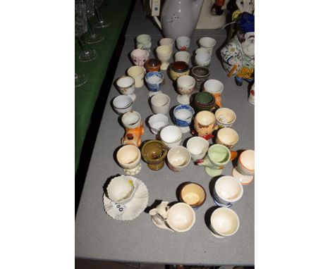 A Royal Doulton "Frost Pine" coffee pot; and a quantity of egg cups by various makers, to include: Spode; Wedgwood; Carlton w