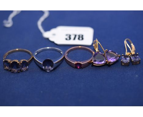 Amethyst jewellery, to include: two rings; and two pairs of drop earrings; together with a garnet ring, all in 9ct. gold moun
