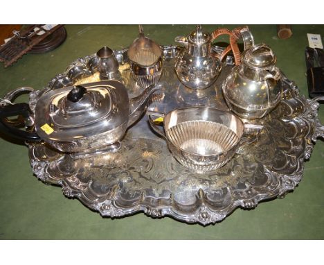 Silver plated ware: a large Victorian shaped two-handled tray; two hot water jugs by Windermere; a teapot; a cream and sugar 