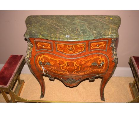 A Louis XVI style kingwood marble top bombe commode, marquetry detailing to drawers, brass mounts, 87cms wide.