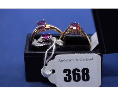 Three garnet rings, one set with diamond shoulders, in 9ct. yellow gold shanks, ring sizes R/S.