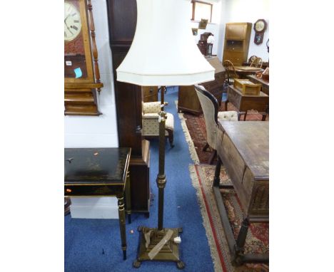 A BRASS TELESCOPIC STANDARD LAMP WITH SHADE