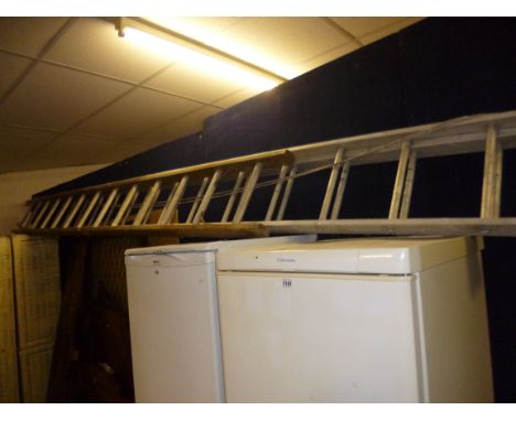 A DOUBLE ALUMINIUM AND WOODEN EXTENDING LADDER, approximate size length 415cm