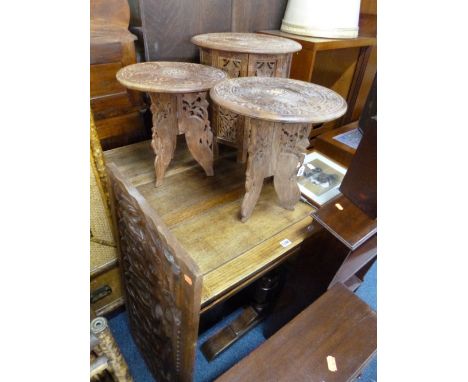 THREE FOLDING CARVED HARDWOOD TABLES, and a carved hardwood panel (4)