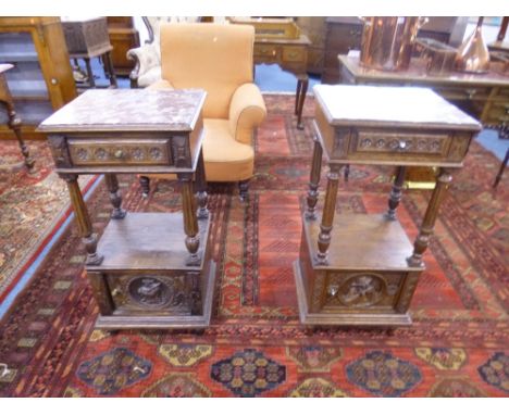 A PAIR OF CARVED OAK CABINETS, with pink veined marble tops, single drawers, shelf and lower cupboard