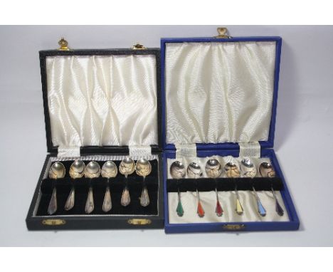 A CASED SET OF SIX SILVER TEASPOONS, with coloured enamel fan decoration, Birmingham 1957, together with a cased set of six s