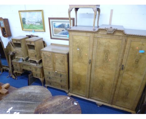 A BLEACHED WALNUT NINE PIECE BEDROOM SUITE, comprising triple door wardrobe, tall boy, dressing table, pair of single beds, p