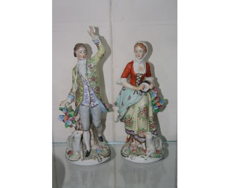 A PAIR OF SITZENDORF FIGURES, gentleman with raised arm and recumbent sheep, lady with tamborine and recumbent sheep (2)