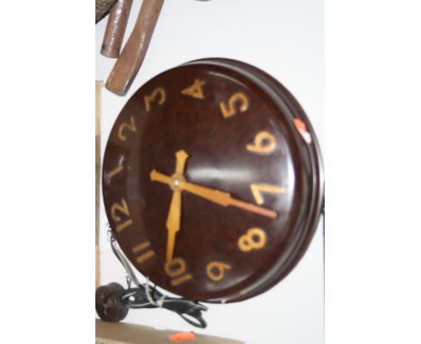 A SMITHS ELECTRIC BAKELITE WALL CLOCK
