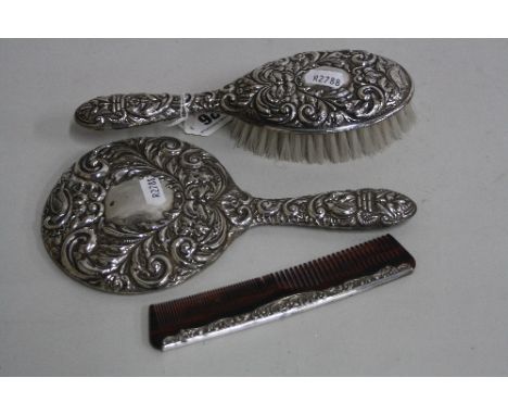 A SILVER DRESSING TABLE SET, to include brush, mirror and comb, hallmarks for Birmingham