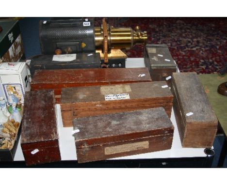 SEVEN BOXES OF MAGIC LANTERN SLIDES, to include 'Round the World in 100 Minutes' etc, together with magic lantern