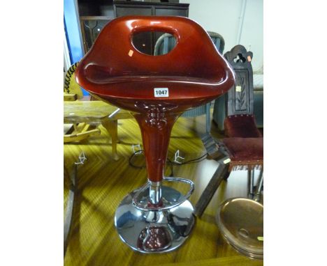 A MODERN SWIVEL BAR STOOL