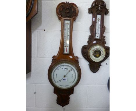 AN OAK CASED WALL BAROMETER
