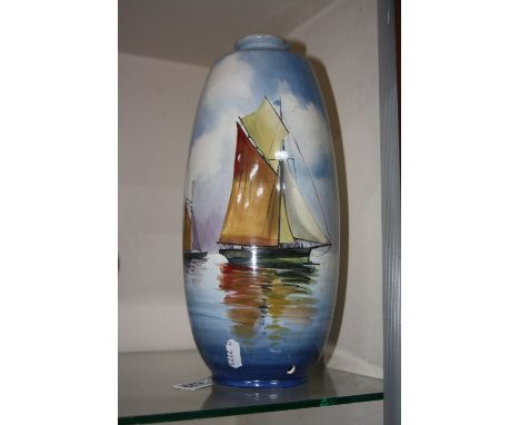 A VASE CONVERTED TO A LAMP BASE, decorated with sailing boats, signed Dean, height approximately 32cm