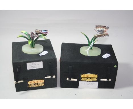 TWO WHITE METAL AND ENAMEL BOXED FIGURINES, depicting a butterfly and a fly
