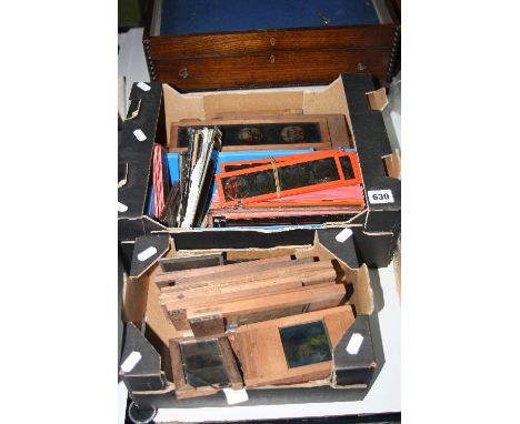 TWO BOXES OF MAGIC LANTERN SLIDES, some framed, to include animated examples