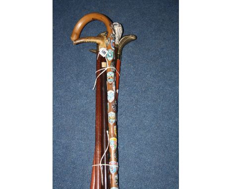 SIX VARIOUS WALKING STICKS, to include a silver collared stick (6)