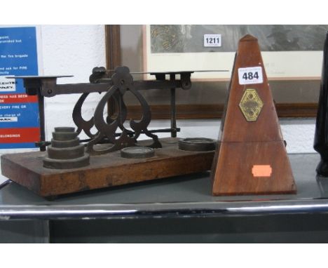 A METRONOME, and a set of postal scales and weights