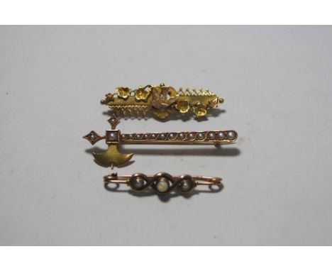 THREE VICTORIAN BROOCHES, to include a small opal bar brooch, a friendship brooch and a brooch within the shape and an axe wi