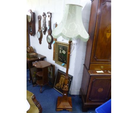 A WALNUT STANDARD LAMP WITH SHADE 