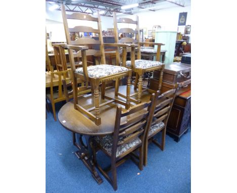 AN OAK EXTENDING DINING TABLE, and six ladder back chairs including two carvers with tapestry upholstered seats