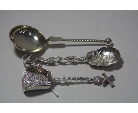 THREE SILVER CADDY SPOONS, moulded bowl with repousse cherub decoration and windmill terminal, London 1901, floral decorated 