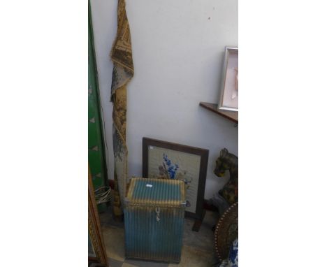 A wall tapestry, a fire screen and wicker ottoman 