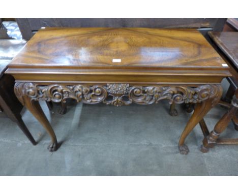 An Italian Rococo style carved walnut console table 