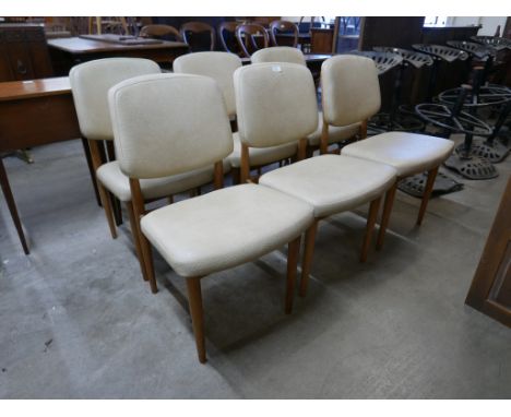 A set of six light elm and cream vinyl chairs 