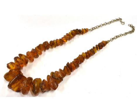 RAW AMBER &amp; SILVER NECKLACE 50cm long, comprising numerous raw amber pieces, approx 8.6-23.3mm, on two lengths of silver 