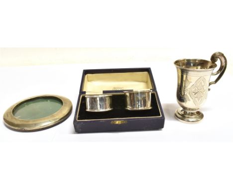 VARIOUS ANTIQUE SILVER ITEMS  To include a Victorian engraved cup on pedestal foot with single scroll handle, hallmarked Birm