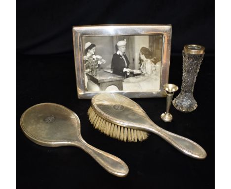 ANTIQUE SILVER MOUNTED ITEMS  To include a monogrammed hairbrush and hand mirror, hallmarked London 1924.  A 13cm tall, hobna