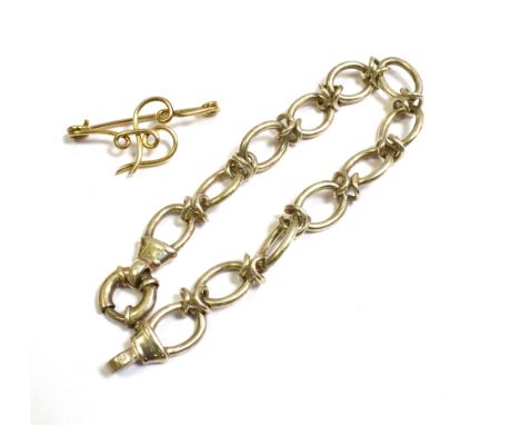 GOLD BROOCH &amp; SILVER BRACELET  Brooch tests as 9ct gold, comprising round wire forming an 'F' monogram with safety pin st