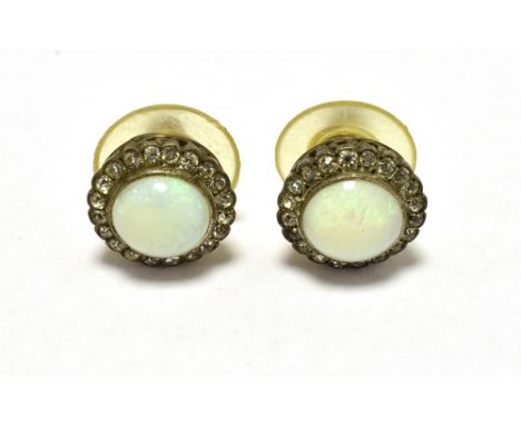 VINTAGE OPAL HALO STUD EARRINGS The earrings set with a circular opal measuring 9mm in diameter in a halo of clear stone acce