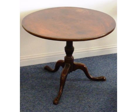 A good 18th century circular mahogany tilt-top Occasional Table, the one-piece top above a turned gun barrel style stem leadi