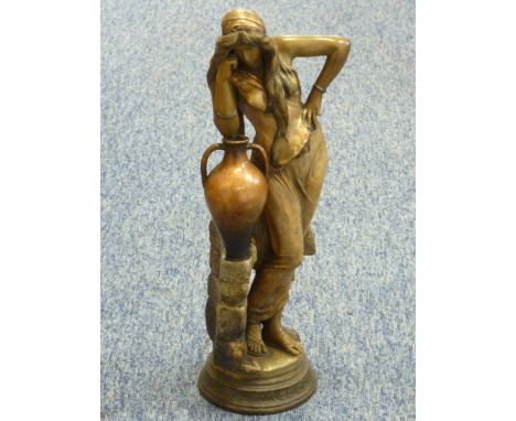 Fredrik Goldscheider (Austrian, 1845-1897), "Rebecca", a bronzed terracotta Figure of a female leaning on an amphora before a