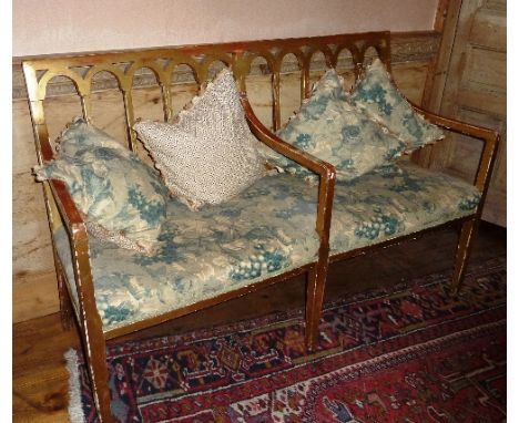 A George III style giltwood Sofa, arcaded back and raised on three square tapering front legs