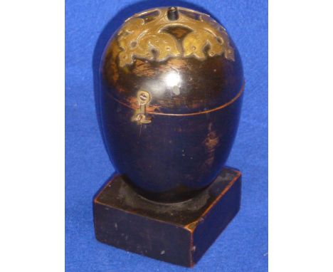 An unusual 19th century ebonised and brass mounted Treen Tea Caddy (possibly modelled as a melon?), raised on square plinth b