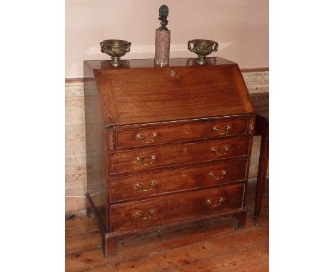A late 18th century mahogany Writing Bureau, the angular cleated fall opening to reveal fitted interior of pigeonholes and dr