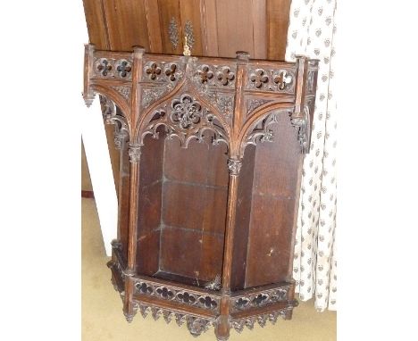 A late 19th century set of wall hanging Shelves highly carved in the French Gothic style with quatrefoil foliate carving and 