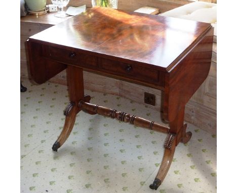 A good and unusual Regency period mahogany Sofa Table of diminutive proportions, two half-width drawers, two dummy drawers op