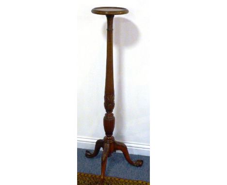 A late 18th century style (reproduction) circular dished-top mahogany Torchere, turned reeded stem leading to carved ears of 