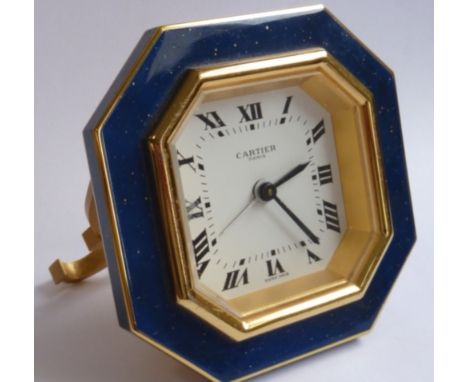 A 20th century Cartier, Paris octagonal lapis lazuli travelling Alarm Clock, the octagonal white dial having Roman numerals a